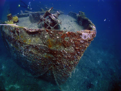 The bow of a ship wreck comes into view from the depths in Grenada