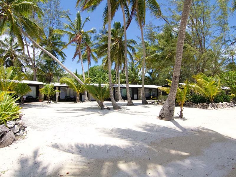Cottages at Small hope Bay face a white sand beach. Cottages at Small hope Bay face a white sand beach.